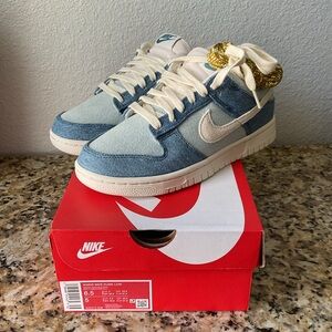 Nike Women’s Dunk Low Sneakers in Light Blue Denim and Cream with Gold Accent